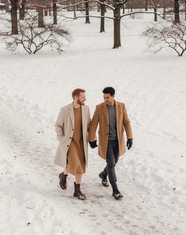 AI-generated example with fictional people: A couple in cream and camel wool coats